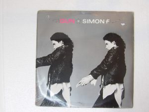 Simon F (Fellowes): Gun 1985 U.S Mint Sealed LP
